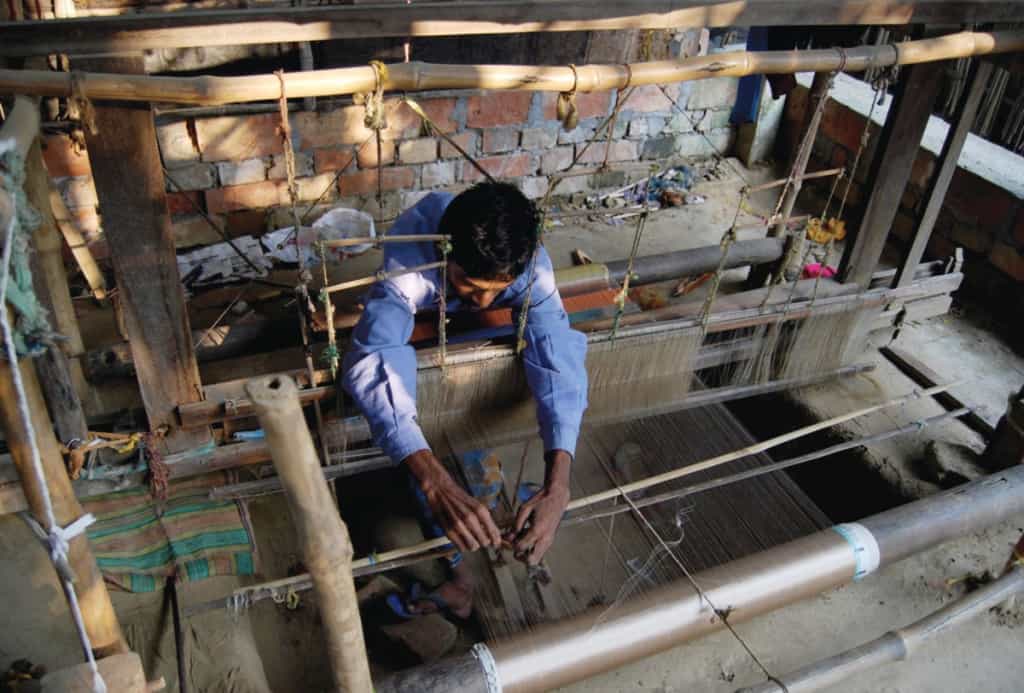 Adjusting a loom at Chhandabrati Weavers